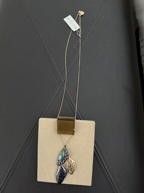 Gold Tone Pendant Necklace with Multicolor Leaf Charms -